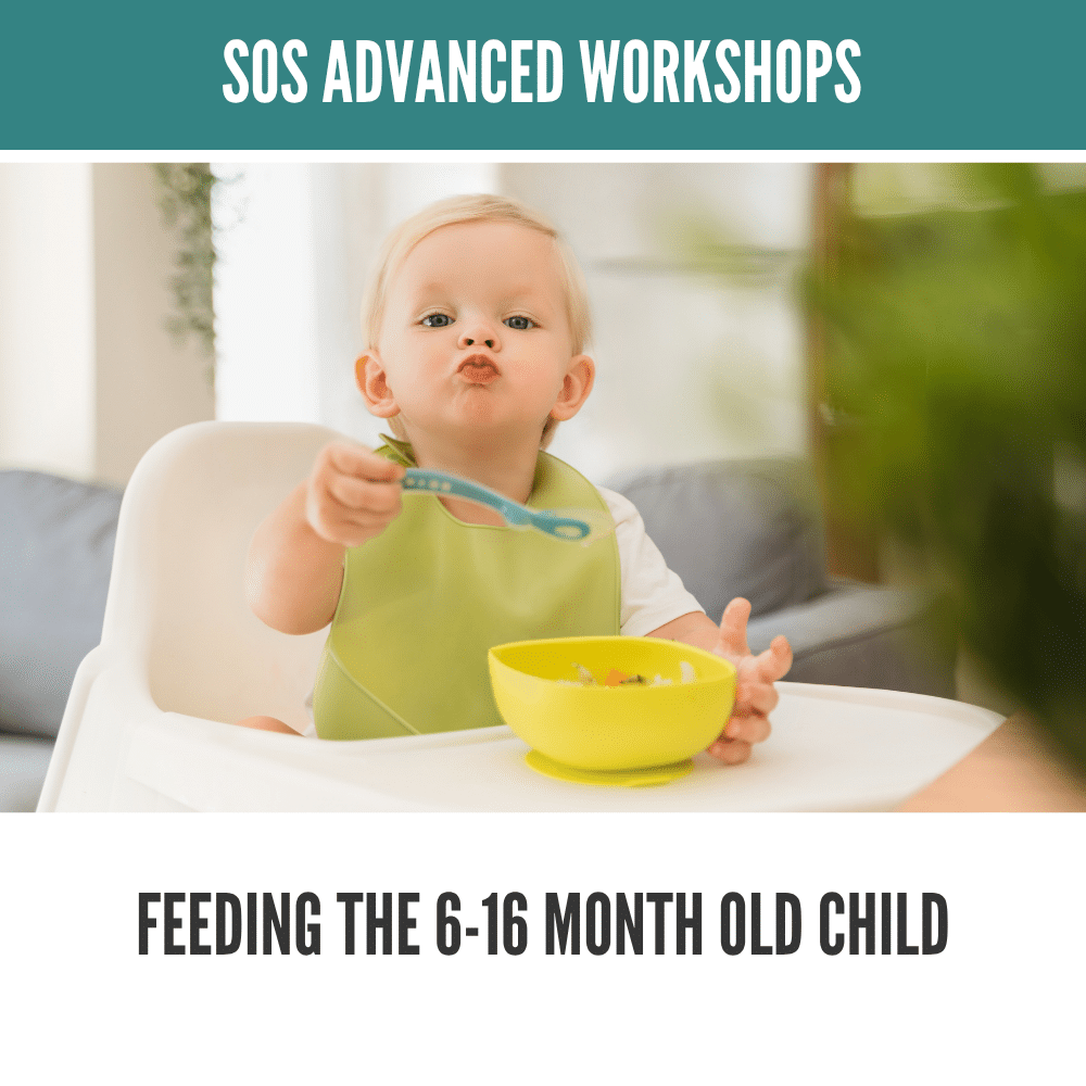 Baby in high chair holding a spoon, wearing a green bib, next to a yellow bowl.