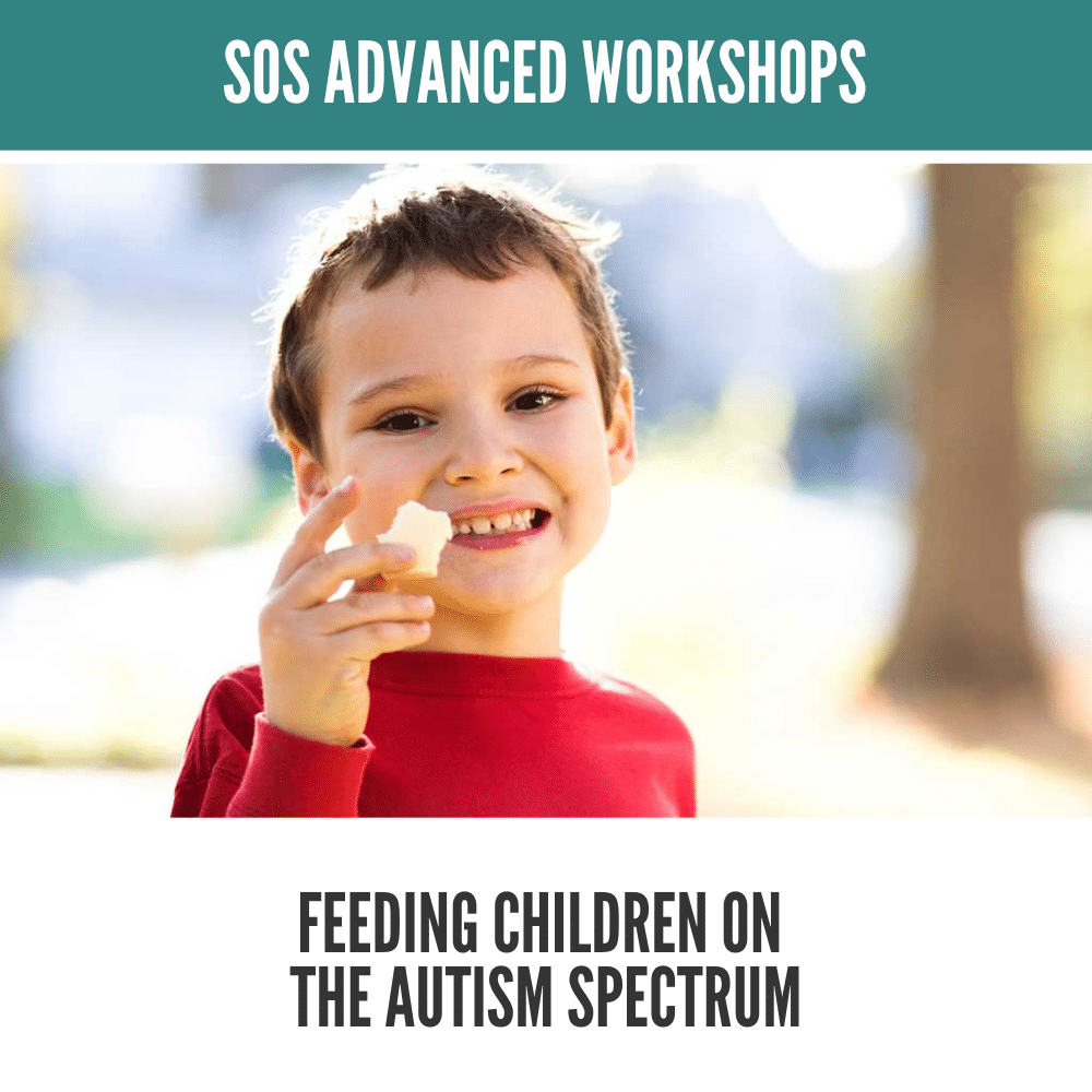 Child in a red shirt smiles while holding a piece of food, reflecting joy and engagement in eating.