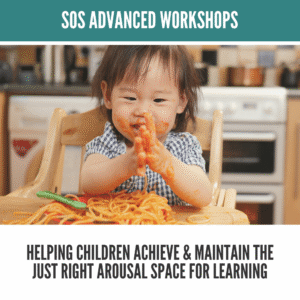 Smiling toddler playing with spaghetti, hands covered in sauce.
